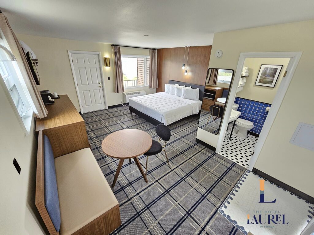 Bedroom at the Hotel Laurel, showing bed, table, sitting area